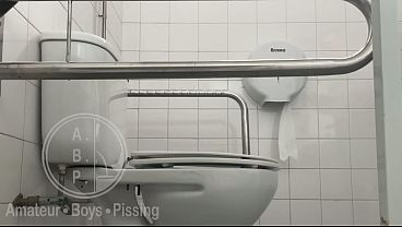 In the Hospital Toilets, a Guy Pisses Into a Cup for a Urine Sample, Then Gets Horny, Jerks-off and Cums